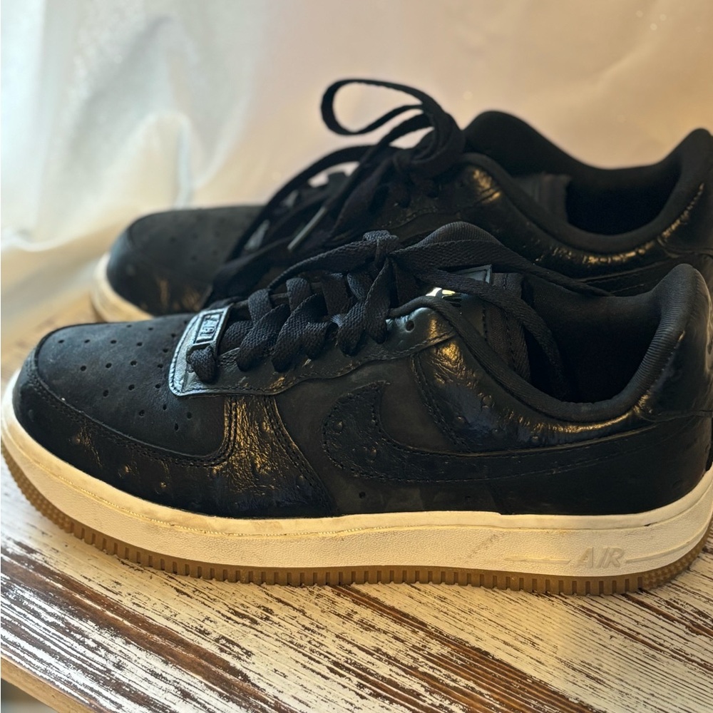 Nike Air Force 1 Sneakers with Gold Logo